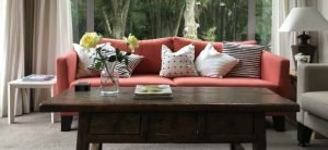 Black and white cushions on red sofa