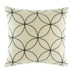 light coloured cushion cover with fine black circles that interlock