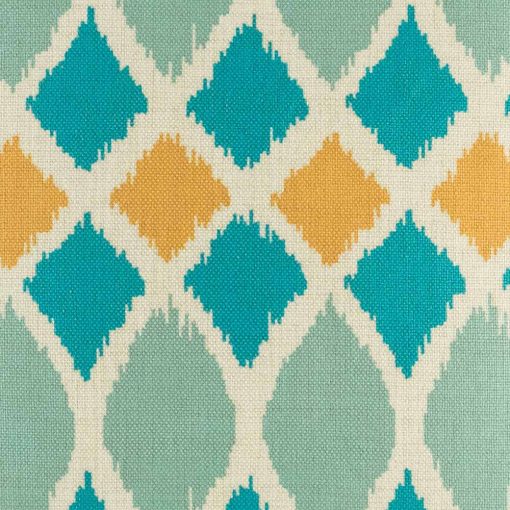 Close up of teal and orange geometric shapes on a cushion cover