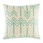 Light cushion cover with double headed arrow pattern in teal