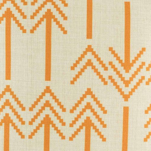 Close in view of orange double arrow heads on cushion cover