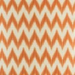 Close up view of orange zig zag cushion cover