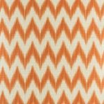 Close up view of orange zig zag cushion cover