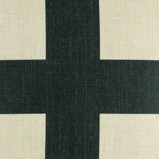 Zoomed in view of large black cross on cushion cover