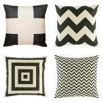 Collection of four cushion covers with black prints