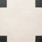 Close up of cotton linen cushion with black print