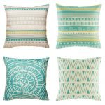 Collection of four cushion covers with teal and yellow accents