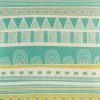 Close up of teal and yellow striped cushion cover