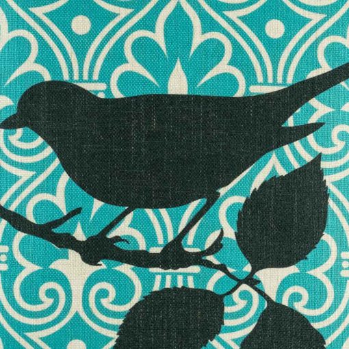Close up of black bird motif on scatter cushion cover