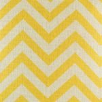 Close up view of yellow chevron design on cushion cover