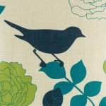 Close view of bird image on cushion cover in dark blue