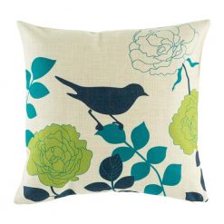 Dark image of bird on cushion with teal green and dark blue