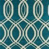 Close up of decorative cushion with swirling blue deisgn