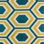 Close up of yellow and blue geometric pattern on cushion cover