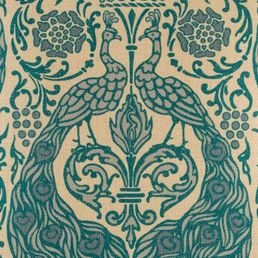 Close up pattern on cushion with turquoise peacock pattern