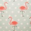 Close up of light blue cushion with flamingo pattern
