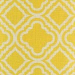 Close up of bright yellow cushion cover with pattern