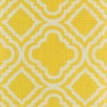 Close up of bright yellow cushion cover with pattern