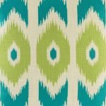 Close up shot of teal and green print on decorative cushion cover