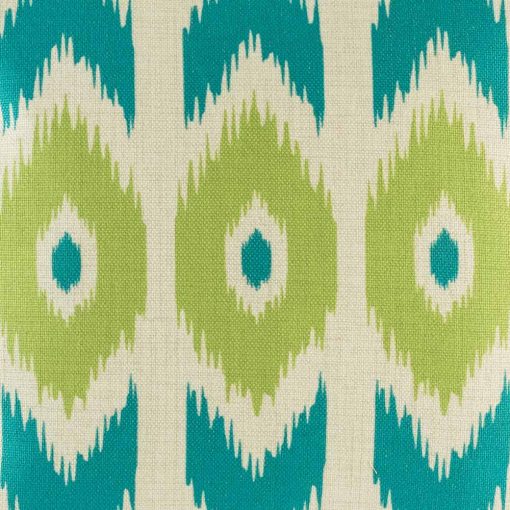 Close up shot of teal and green print on decorative cushion cover