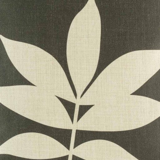 Close up of brown cushion cover with leaf