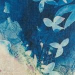Close up showing blue painted scene of cushion