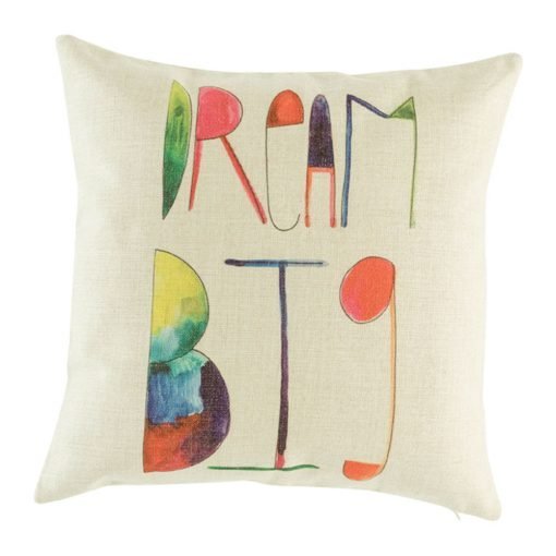 Light coloured cushions cover with words dream big on it