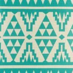 Close up of teal cushion cover with triangular patterning