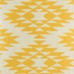 Close up of decorative cushion with yellow print