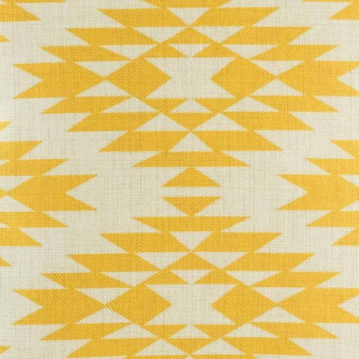 Close up of decorative cushion with yellow print