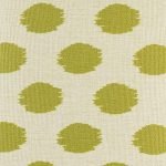 green gold polka pattern up close on cushion cover