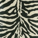 Close up showing black and white zebra print cushion cover