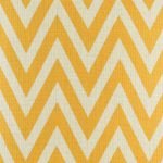 Close up view of yellow zig zag pattern cushion