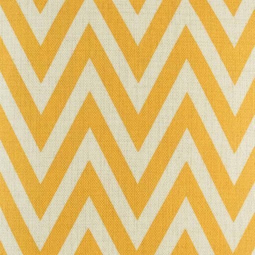 Close up view of yellow zig zag pattern cushion