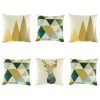 Beautiful 6 cushion collection with 2 brown triangle trees, 3 teal, green and blue geometric diamonds and 1 bold stag head cushion cover