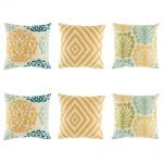 6 cushion cover set with 3 designs in yellow diamond, yellow, dark blue and light green royal swirl and a fern style