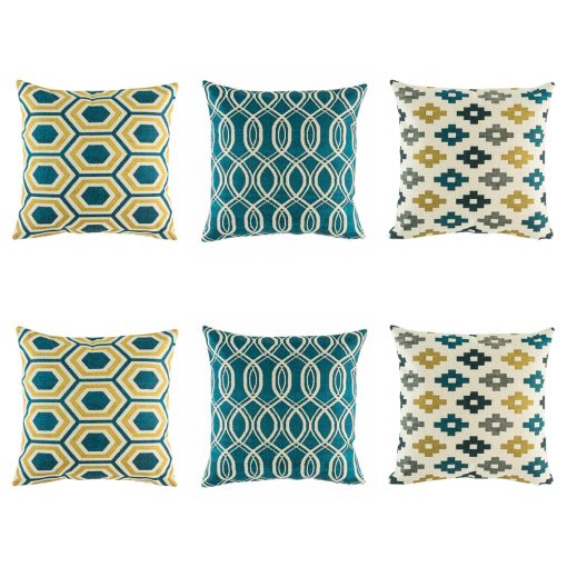 Yellow, blue and grey cushion cover set with striking swirl, repeating pixel and hexagon design