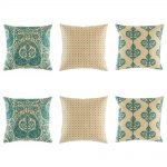 Elegant cushion cover set in teal and natural linen with peacock motif, polka do and royal swirl designs