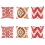 Predominantly pink and red cushion cover set with some light blue and yellow colouring