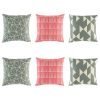 6 cushion cover collection with 2 grey geometric, 2 pink lined and 2 grey triangle styles
