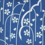 Close up of cotton linen cushion cover with blue and white vine design
