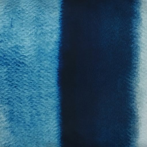 Close up of monochromatic blue velvet cushion cover