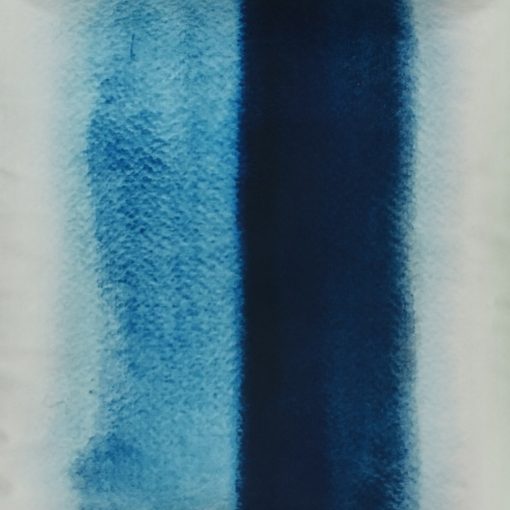 Close up of monochromatic blue in stripe design velvet cushion