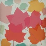 Close up of pastel coloured leaves velvet cushion