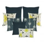 A collection of 8 blue and white cushion covers with arrow and diamond patterns