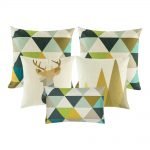 A collection of five colourful cushion covers with triangle and moose designs