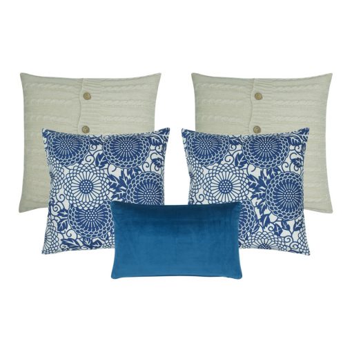 A collection of 5 square blue and white cushions in solid, floral and cable knit patterns