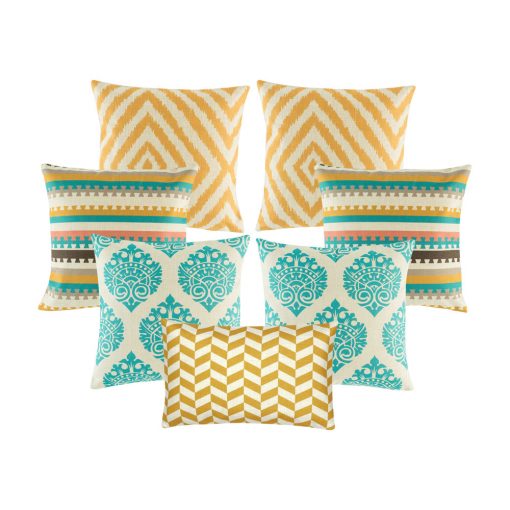A set of 7 cushion covers with diamond and, zigzag and crown patterns in gold and teal colours