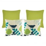 A photo of four, lime colour based square cushions
