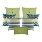 A collection of 7 green and blue , square and rectangular cushions with cable knit, lines, chevron and solid patterns